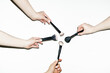 © Colour Laboratory/Stocksy - Hands holding various make up beauty brushes for different products