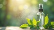 © yuntunen - Transparent spray bottle with mist and green leaves in sunlight