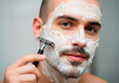 © sebastianav1994 - Young man with Shaving Cream and Razor, Closeup Portrait,