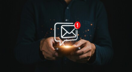 A man uses a smartphone with an incoming message notification, indicating communication and potential digital interaction.