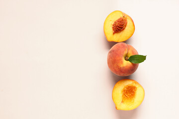 Wall Mural - sweet ripe peaches on beige background