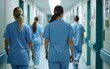 © zhao - Hospital Hallway with Doctors, Nurses and Specialists in Hospital. Female and Male Physicians, Surgeons, Healthcare Officials Walk Together in Corridor with Their Back to Camera. High quality