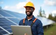 © gu - Happy black service engineer with laptop doing solar panels maintenance. High quality