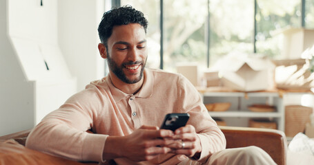 Smile, texting and man in home with mobile, doom scrolling and funny chat on app. Digital, meme and Asian male in living room with tech, virtual game or online communication in message update.