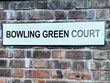 Street sign for Bowling Green Court in Manchester against a brick wall background