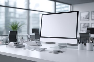 blurred background of a modern office interior with a white desk and computer monitor mockup, a minimalist work space for a graphic designer or web developer, with copy space.