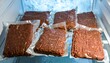 © Nizar - Vacuum-sealed ground meat packages in a refrigerator