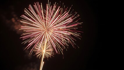 Vibrant fireworks exploding in a night sky, creating colorful sparks and dramatic light trails.