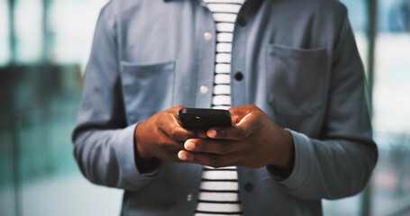 Texting, hands and person in business with phone, text message or communication in creative agency. Typing, technology and man in office with email feedback, mobile app or social media content plan.