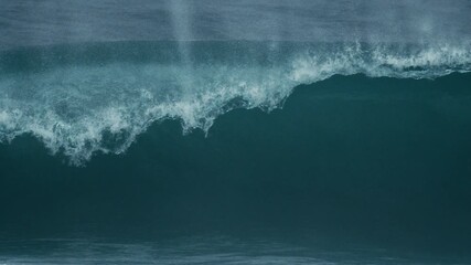 Wall Mural - Moody ocean wave rolls cleanly with smooth dark face and foamy lip detail