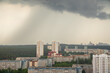 rain in the metropolis. Ominous storm clouds loom above a city skyline