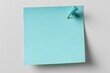 © Yasfar - Light teal sticky note affixed to a surface with a light teal pushpin
