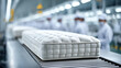 © Andrew - Mattress Production Line: A factory scene reveals a mattress being manufactured on a production line, showcasing precision and quality control. The crisp, new mattress, ready for shipment.