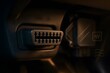 © megh - Close-Up of OBD-II Diagnostic Port Under Dashboard with ECU Module in Background