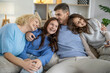 © ivanko80 - Happy family enjoys cozy moments together at home during a relaxed afternoon in a comfortable living room setting