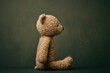 © Can Berkol - classic teddy bear plush toy side profile on dark background