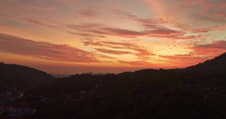Wall Mural - aerial view stunning sunrise above archipelago Phuket. beautiful moving cloud in vivid sky at sunrise. 4k stock footage video in travel concept. amazing colorful clouds over the horizon