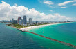 Aerial view of Miami Beach with turquoise waters. Drone shot of Miami skyline. Top view of South Miami Beach. Miami cityscape with luxury skyscrapers and ocean. View of Miamis famous skyscrapers.