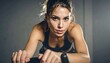 © Urip - Focused woman on stationary bike