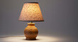 © PNG Stock - Vintage ornate ceramic table lamp with patterned lampshade casting warm light