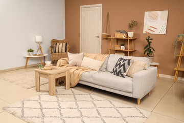Wall Mural - Interior of stylish living room with grey sofa, table and door