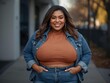© erlin - Confident plus size woman smiling in casual denim outfit outdoors