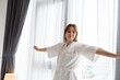 © chachamp - Happy Caucasian woman with towel in bedroom