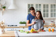 © BestForYou - Young man and woman are jointly preparing wholesome vegetable-based meals in the kitchen, enjoying quality time together and focusing on balanced eating