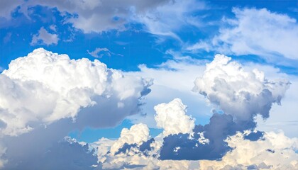 Wall Mural - White Puffy Clouds Floating in a Blue Sky on a Sunny Day with Soft Lighting Creating a Calming and Dreamy Atmosphere Nature Background