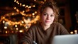 © Freshpixel - A cozy image of a young woman smiling while sitting at a table in a coffee shop, surrounded by warm decorative lights, evoking feelings of comfort and connection.