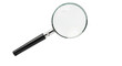 © Sean - Isolated magnifying glass enhances the examination of text below in a close-up perspective