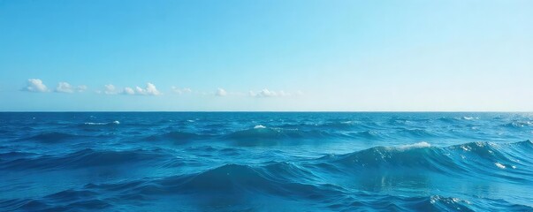 Wall Mural - Vast expanse of deep blue ocean water, waves gently rolling under a clear sky  Perfect for travel, nature, and serenity themes ,  horizon line,  deep,  image