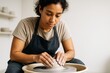 © Pixels Hunter - Focused woman shaping clay on pottery wheel during hobby activity in ceramic studio with soft light and neutral background. Ai generative. Ai generative
