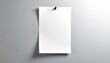 © otra - Minimalist composition showing a blank white note pinned to a smooth gray wall, with soft lighting and shadow for a realistic mockup