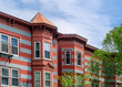 Striking red and grey striped facade of a residential building in Cambridge, Massachusetts, USA
