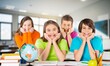 © BillionPhotos.com - Happy cute school kids learning in the class.