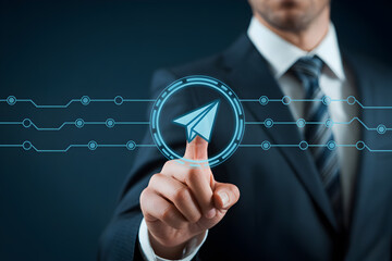 Businessman touches a digital paper airplane icon representing sending data and communication online now