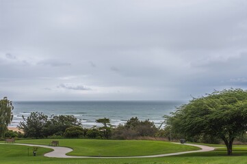 Wall Mural - Seaside panorama seen from a green space under overcast skies