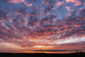 Wall Mural - Vibrant evening clouds under a colorful sky
