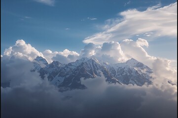 Wall Mural - Dramatic mountain summits framed by a moody cloudy sky.
