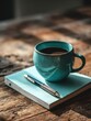 © nana - serene desk scene captures teal wooden workspace soft morning light featuring notebook pen lying flat alongside coffee cup. High quality