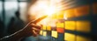 © Padungpong - A person points at a glowing digital board filled with sticky notes, suggesting planning, teamwork, and workflow organization in a modern office setting