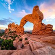 © olin - Red rock arch at sunset