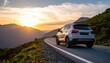 © Ai_Stock - Silver SUV Driving on a Scenic Mountain Road at Sunset.