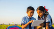 © PRASANNAPIX - happy indian Village school students using tablet together
