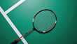 © Nadina - Top view of a badminton racket with broken strings, located diagonally on the green line of the court, balanced geometric composition