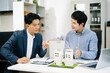 © Nuttapong punna - Two professional men analyzing house model and design layout in office. Ideal for themes of architecture, investment, real estate, property