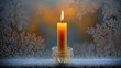 © Raisa - Single candle glowing on frosty window at dusk, concept of Winter Getaways