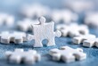 © Snap - Single white jigsaw puzzle piece amidst many (1)