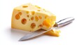 © Balbod - A wedge of cheese with holes, sliced by a knife, isolated on white